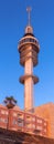 A telecommunications tower in Cadiz against a blue sky at sunset. Royalty Free Stock Photo