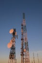 Telecommunications tower at sunrise and blue sky Royalty Free Stock Photo