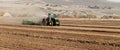 Farm machinery planting rows of wheat Royalty Free Stock Photo