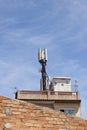 Telecommunications wireless cell phone antennas on the roof of a building. 5g high speed internet transmitters