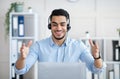 Telecommuting concept. Happy Arab man with headphones working online on laptop, having video call at office Royalty Free Stock Photo