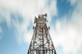 Telecoms building tower under movement cloud with long exposure