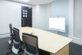 teleconferencing, video conference and telepresence business meeting room with white blank display screen Royalty Free Stock Photo