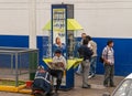 Telefonica telephone booth with people around, Lima, Peru