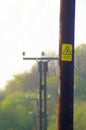 Telegraph poles and a danger sign Royalty Free Stock Photo