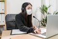 Telemarketer woman working on laptop