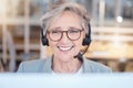 Telemarketing, consultant and senior woman with smile, customer service and call center in workplace. Mature female Royalty Free Stock Photo