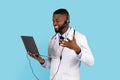 Telemedicine Concept. Black Male Doctor With Laptop And Headset Making Online Consultation, Royalty Free Stock Photo