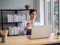 Telemedicine Coronavirus concept. Doctor working with mobile phone and stethoscope and digital tablet laptop in modern office at