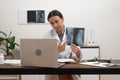 telemedicine video call, doctor presents X-ray films on laptop screen to the patient. Royalty Free Stock Photo