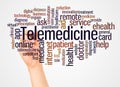 Telemedicine word cloud and hand with marker concept Royalty Free Stock Photo