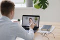 telemedicine, a young adult European and competent doctor in a white coat in a medical clinic in his office sees a Royalty Free Stock Photo