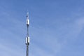 Telephone antenna on blue sky Royalty Free Stock Photo