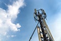 Telephone antenna on blue sky background . View from below Royalty Free Stock Photo