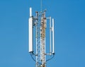 Telephone antenna under clear blue sky Royalty Free Stock Photo