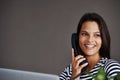 Telephone call, smile and business woman in conversation, talking or listening to contact in startup office. Landline Royalty Free Stock Photo