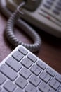 Telephone and computer keyboard Royalty Free Stock Photo