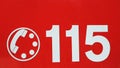 Telephone number 115 on red background of the fire brigade in It