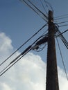 Telephone Pole with Cloudy Blue Sky Background Royalty Free Stock Photo