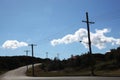 Telephone pole with wires on an empty street Royalty Free Stock Photo