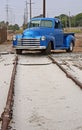 Telephone poles, train track, truck