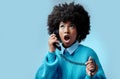 Telephone, wow and surprise black woman with gossip, fake news or fashion sale with blue studio background mockup for Royalty Free Stock Photo