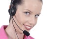 Young adult female woman telephonist, customer service, headset, smiling, looking at camera, white background Royalty Free Stock Photo