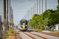 Telephoto shot of the Brightline train on tracks