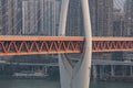 Telephoto view of Qian si men suspension bridge over Jialing river in Chongqing, southwest China