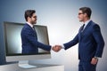 The telepresence concept with two businessman handshaking