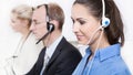 Telesales or helpdesk team with Headsets - workers at call Center. Royalty Free Stock Photo