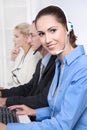 Telesales or helpdesk team - helpful woman with headset smiling