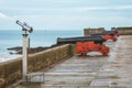 Telescope and cannons on old ramparts