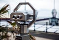 Telescope on Hague bridge in cloudy autumn day