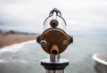 Telescope on Hague bridge in cloudy autumn day