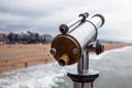 Telescope on Hague bridge in cloudy autumn day