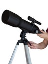 Telescope in the hands on a tripod