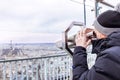 Telescope of Montparnasse. Boy is looking to Eiffel tower.