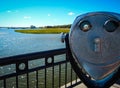 Telescope viewfinder in front of beautiful South Carolina coastline in Charleston on sunny day
