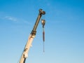 Telescopic boom of a truck mounted crane with hook Royalty Free Stock Photo