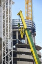 Telescopic crane in the city. Construction industry
