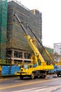 Telescopic cranes are lifting heavy weight. Royalty Free Stock Photo