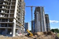 Telescopic handler work at the construction site. Construction machinery for loading. Tower crane during construct a multi-storey Royalty Free Stock Photo