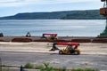 Telescopic handlers working on a shipping warehouse. Day view. Royalty Free Stock Photo