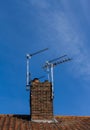 Television aerials on chimney Royalty Free Stock Photo