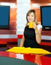 Television anchorwoman has coffee break Royalty Free Stock Photo