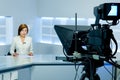 Television anchorwoman during live broadcasting Royalty Free Stock Photo