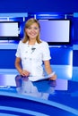 Television anchorwoman at TV studio