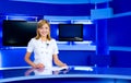 Television anchorwoman at TV studio