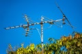 Television antenna on blue sky Royalty Free Stock Photo